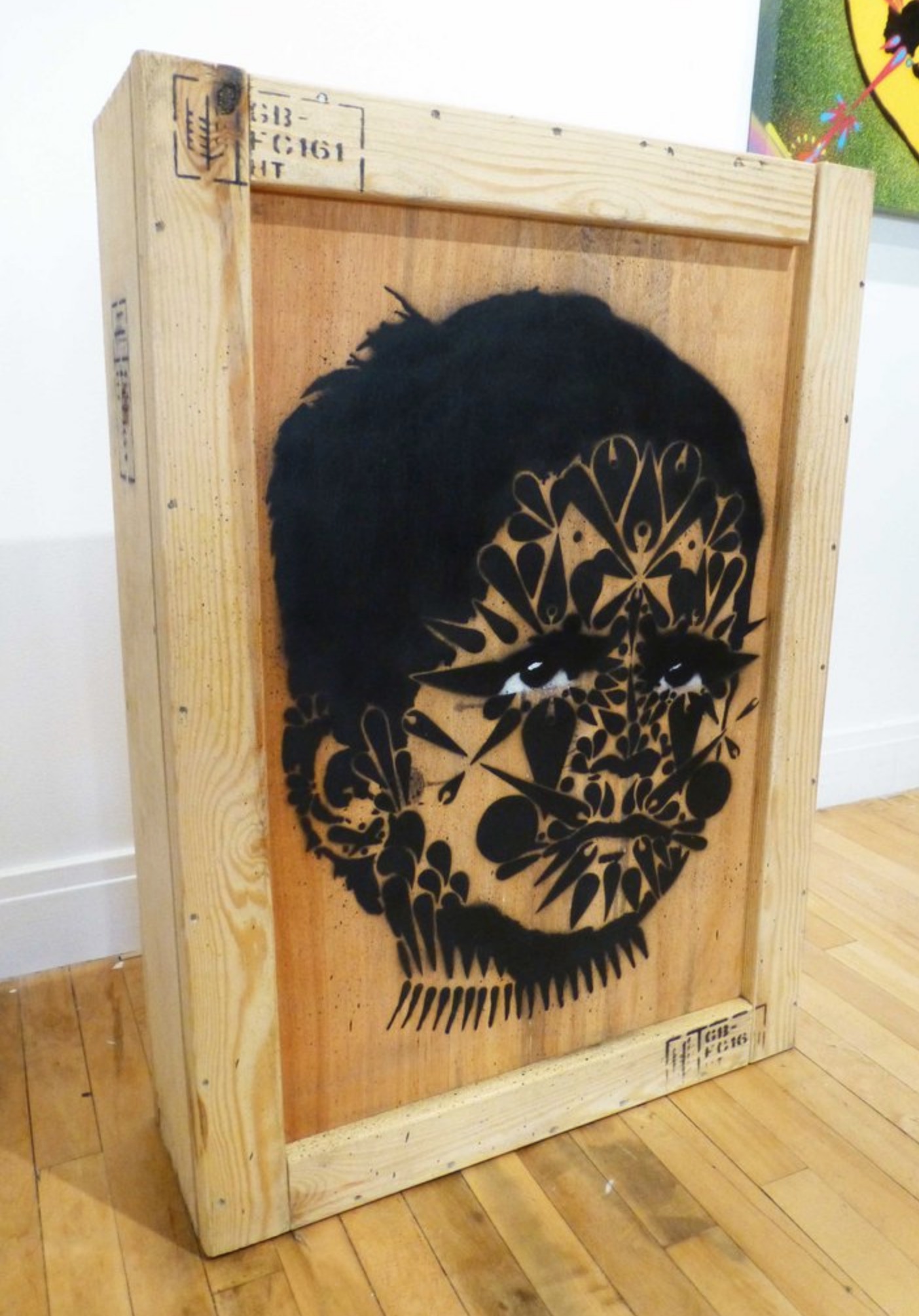 "Delhi Spine Kid," 2019. Spraypaint on wooden crate. 25 x 35 x 8 in.